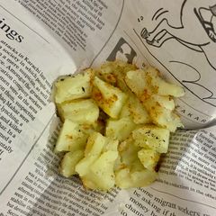 A picture of Street style shakerkandi (roasted sweet potato on Tawa).