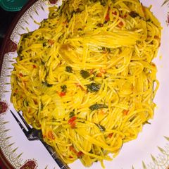 A picture of Red oil Spaghetti with spinach.