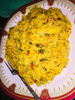A picture of Red oil Spaghetti with spinach.