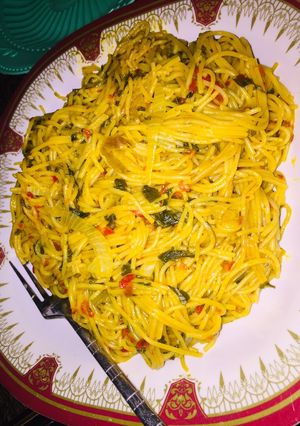 A picture of Red oil Spaghetti with spinach.