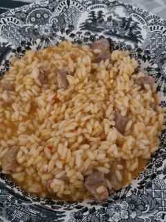 Una foto de Arroz meloso con carne