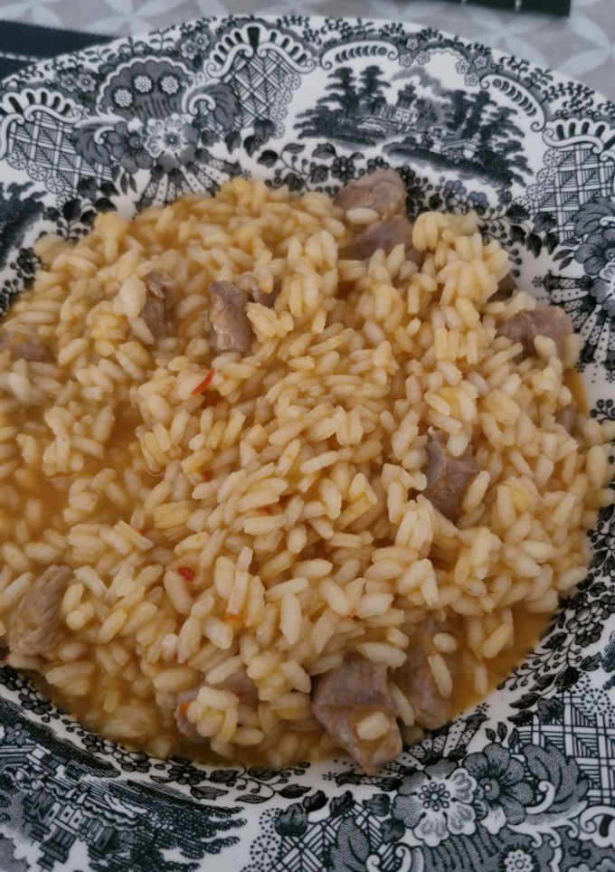Una foto de Arroz meloso con carne