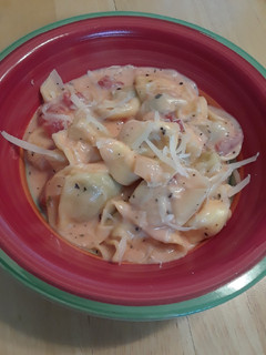 A picture of Tortellini with a Creamy Tomato Basil Sauce.