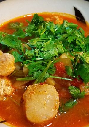 A picture of Sea scallops in tomato onion soup.