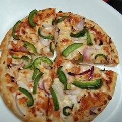 A picture of Capsicum Onion Pizza.