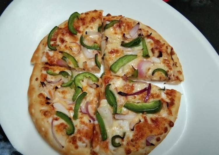 Capsicum Onion Pizza Recipe by Anjana arora - Cookpad