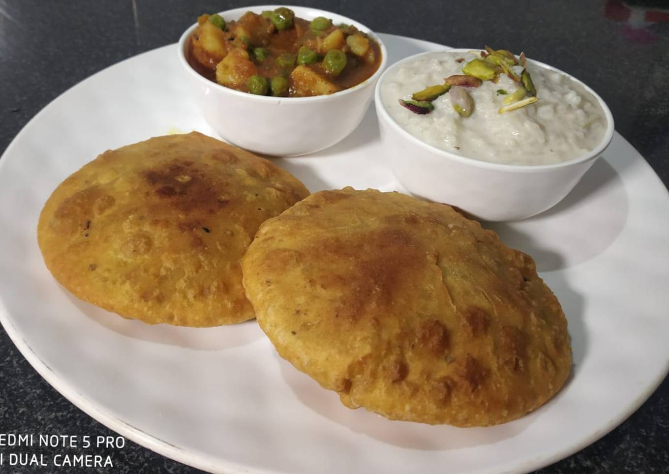 Hare matar ki puri with aloo matar ki sabji & rice kheer