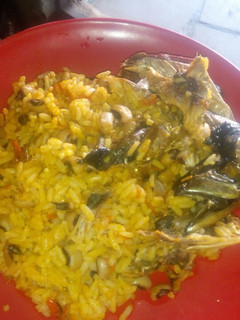 A picture of Palm oil jollof rice and beans.