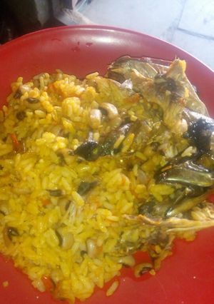 A picture of Palm oil jollof rice and beans.
