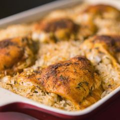 A picture of Oven baked chicken and rice.