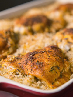 A picture of Oven baked chicken and rice.