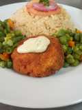 Fish fillet in breadcrumbs,braised rice and mixed vegetables