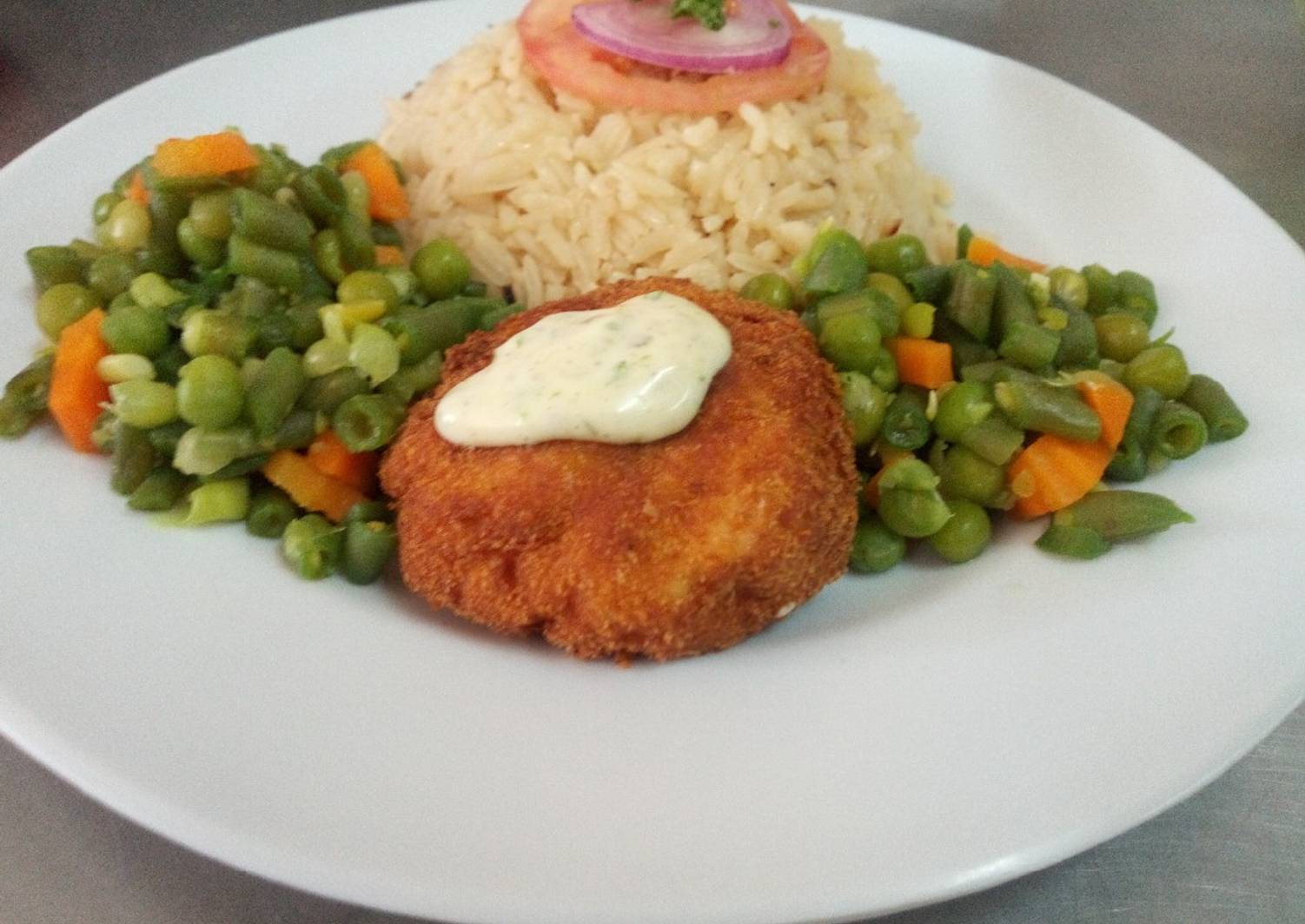 Fish fillet in breadcrumbs,braised rice and mixed vegetables Recipe by
