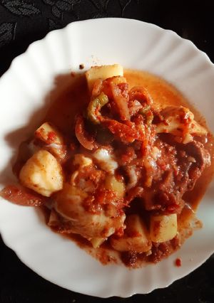Una foto de Bondiola de cerdo y pollo al disco