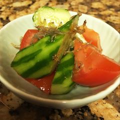 Cucumber and tomato salad with young sardine A picture of Cucumber and tomato salad with young sardine.