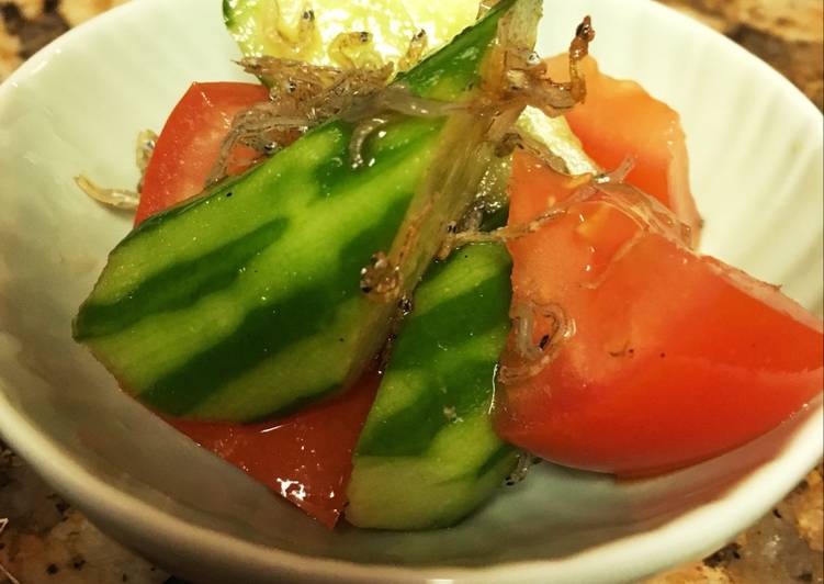 Cucumber and tomato salad with young sardine