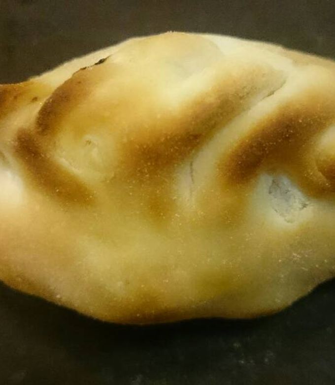 Una foto de Empanadas de panceta, ciruela y cebolla