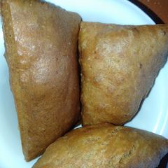 A picture of Mandazi(brown and white).