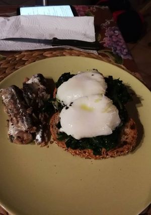 A picture of Bruschetta with Spinach and Poached Egg.