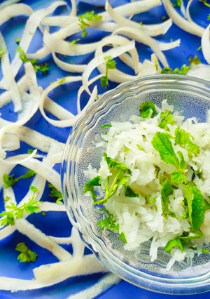 A picture of Grated radish salad (mooli ka laccha).