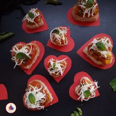 A picture of Heart shaped pizza bites.