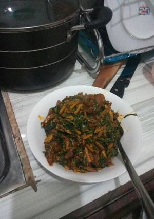 A picture of Ugba with garden leaves.