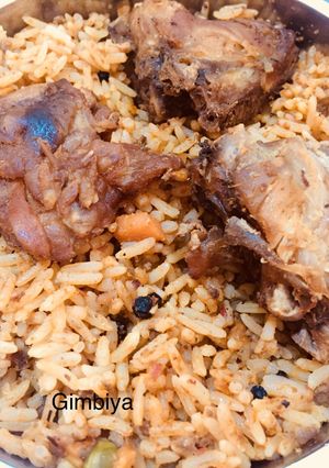 A picture of Jellof Rice with chicken.