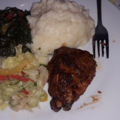 A picture of Mashed potatoes creamy spinach with grilled chicken and salad.