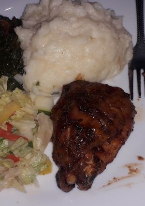 A picture of Mashed potatoes creamy spinach with grilled chicken and salad.