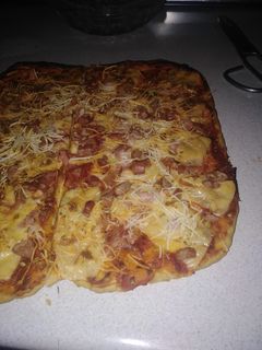 Una foto de Pizza con masa casera