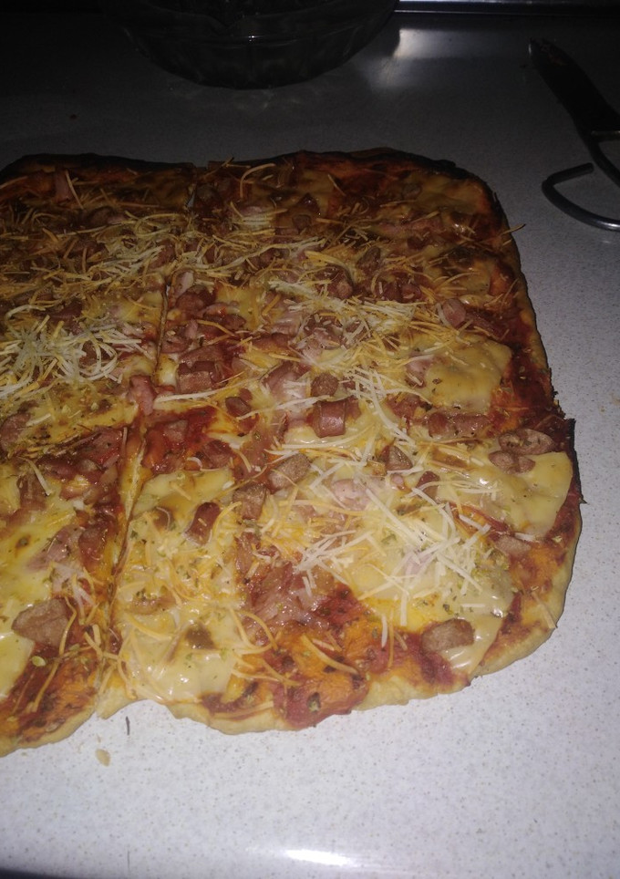 Una foto de Pizza con masa casera
