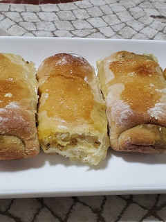 A picture of Bread stuffed with minced meat n cheese.