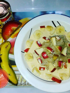 A picture of Oats with Apple and Banana slices.