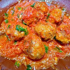 A picture of Meatballs in tomato sauce.