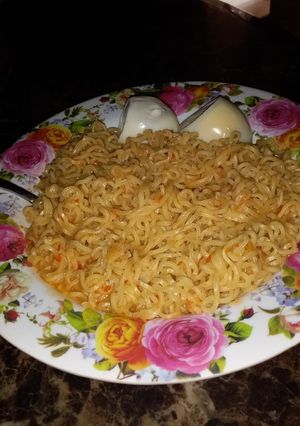 A picture of Indomie and boiled egg.