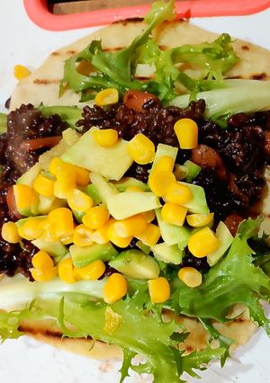 A picture of Mexican Fajitas with Black Rice and Beans.
