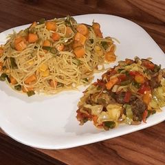 A picture of Fried pasta with veggies sauce.