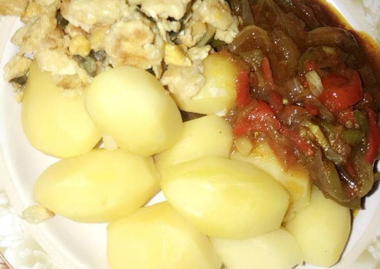 Boiled potatoes with sauce... garnished with scrambled egg 🍳