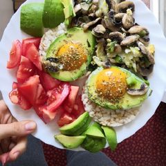 A picture of Eggs in avo with mushrooms and onion.