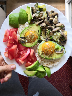 A picture of Eggs in avo with mushrooms and onion.