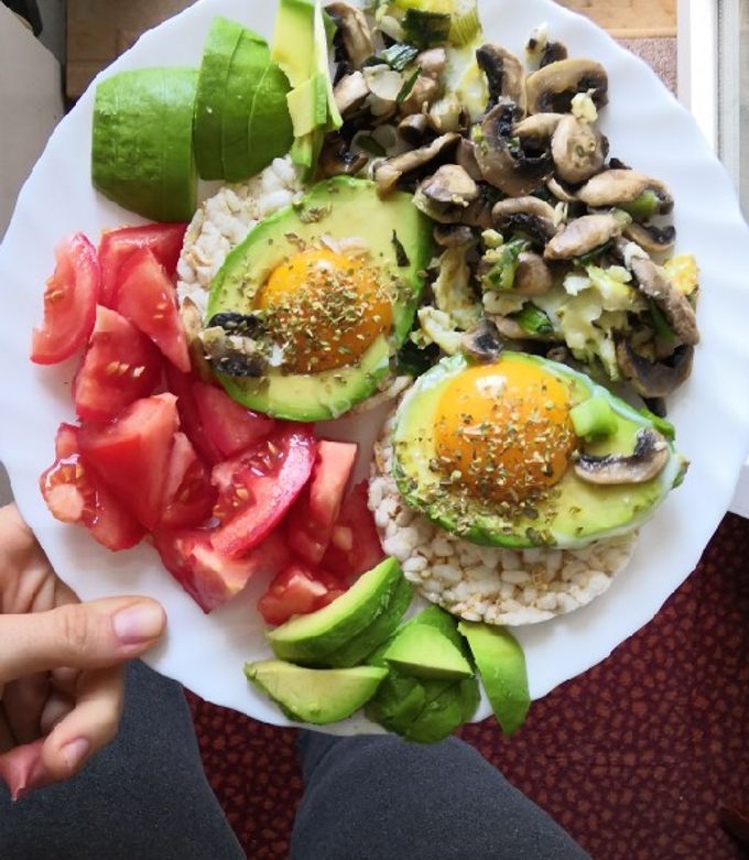 A picture of Eggs in avo with mushrooms and onion.