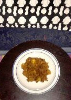 A picture of Beans Jollof with sweet potatoes and smoke fish.