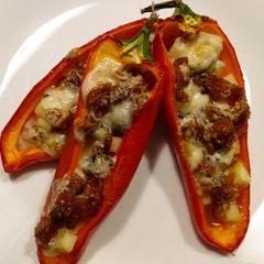 A picture of Blue cheese, bacon, and apple stuffed mini peppers.