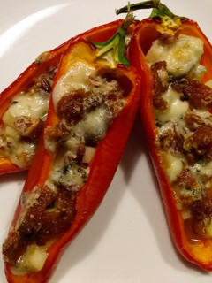 A picture of Blue cheese, bacon, and apple stuffed mini peppers.