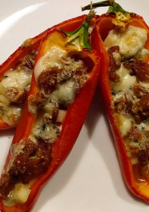 A picture of Blue cheese, bacon, and apple stuffed mini peppers.