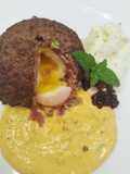 Polpetta con cuore alla coque, salsa alla zucca, spuma di parmigiano e caviale di aceto balsamico
