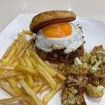 Cheese burger with caramelized onion and egg