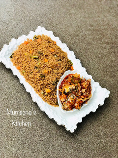 A picture of Fried steam couscous and vegetable stew.