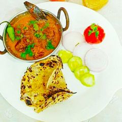 A picture of Lauki balls in chettinad gravy.