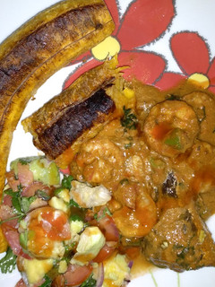 A picture of Grilled tembo bananas prawns in coconut sauce.